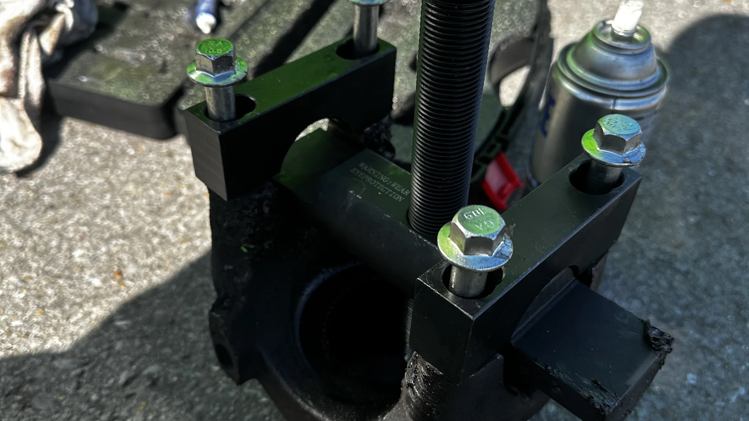 Bearing puller and press tool laid out on the ground
