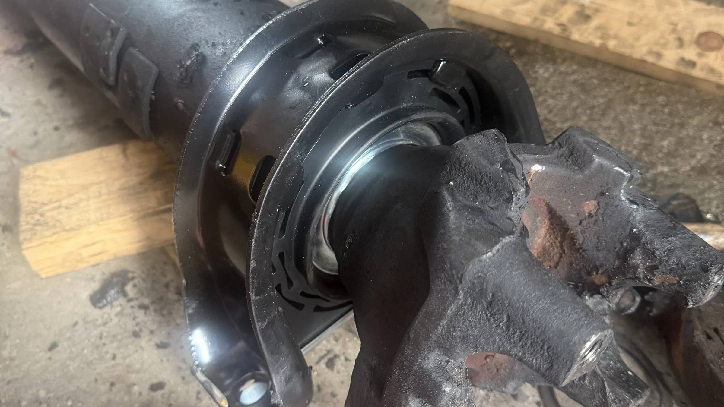 Drive shaft and U-joint laid out on the shop floor