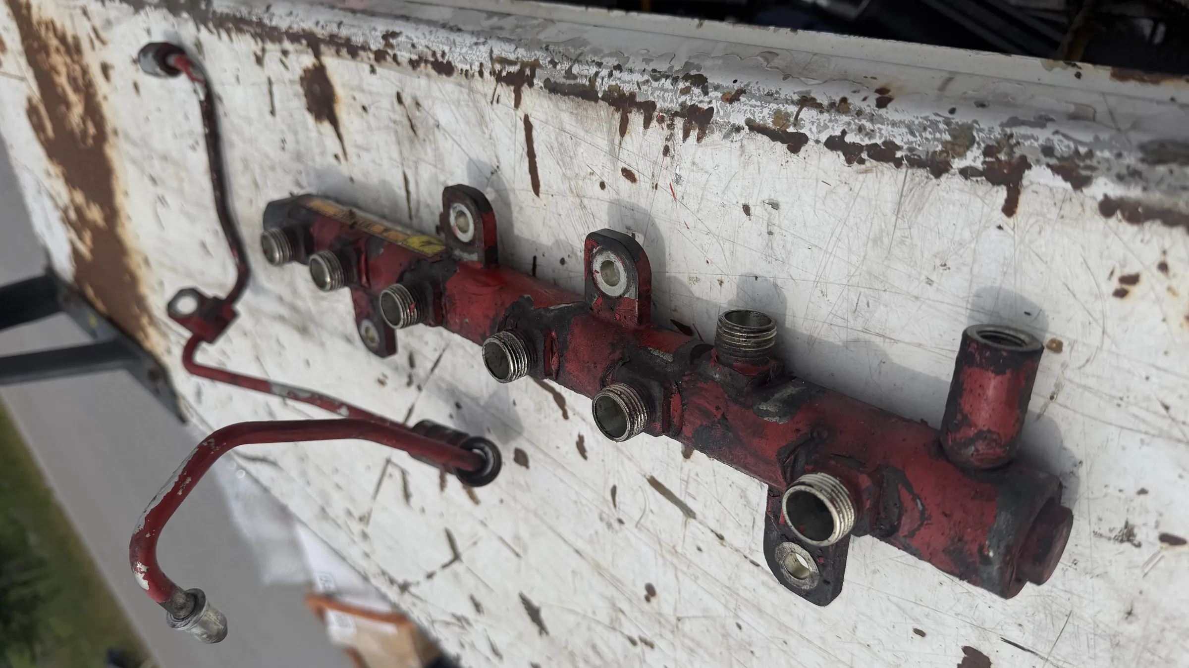 Fuel rail manifold on a workbench