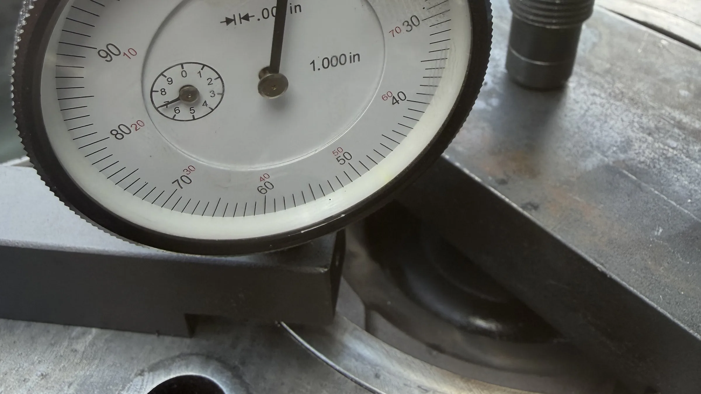 Dial indicator gauging a flange surface