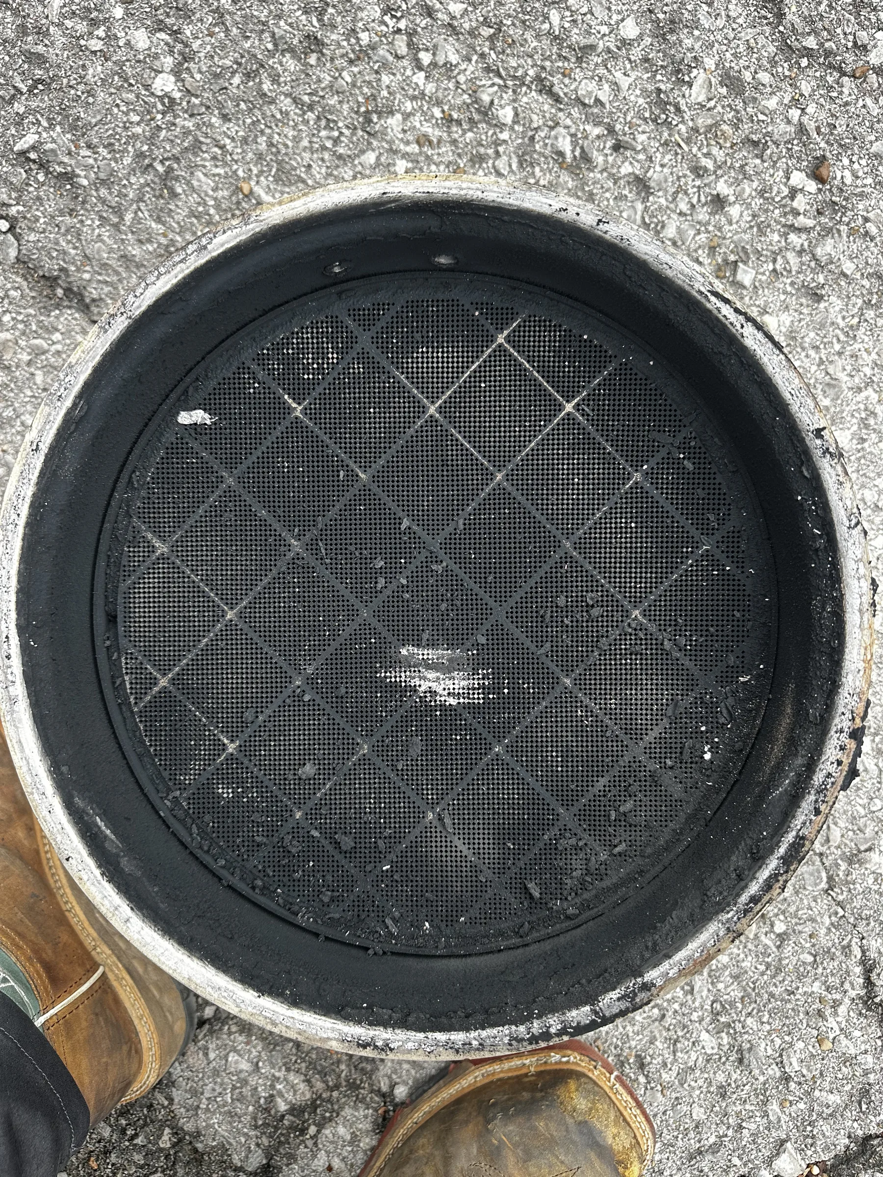 Diesel particulate filter set on the ground after removal