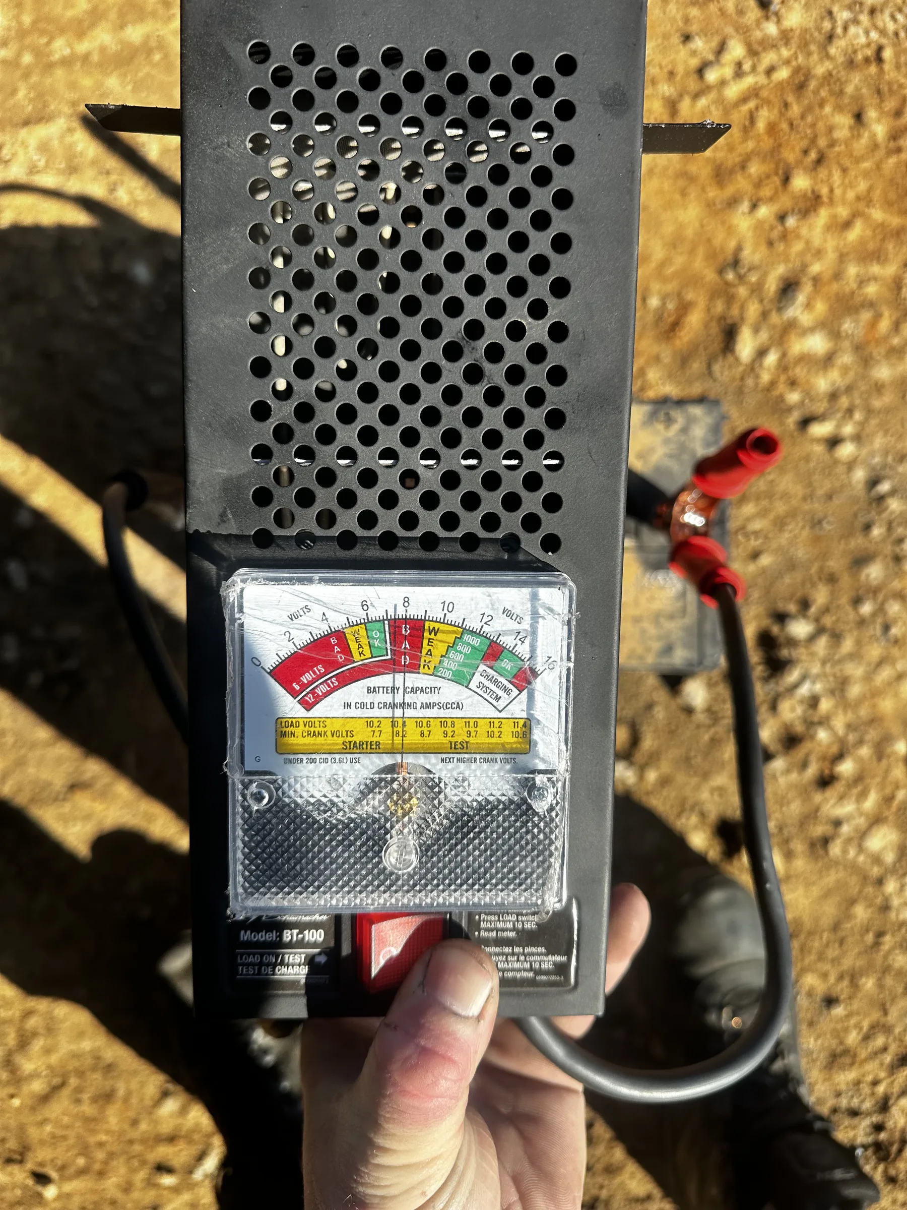 Carbon-pile battery load tester reading a customer battery
