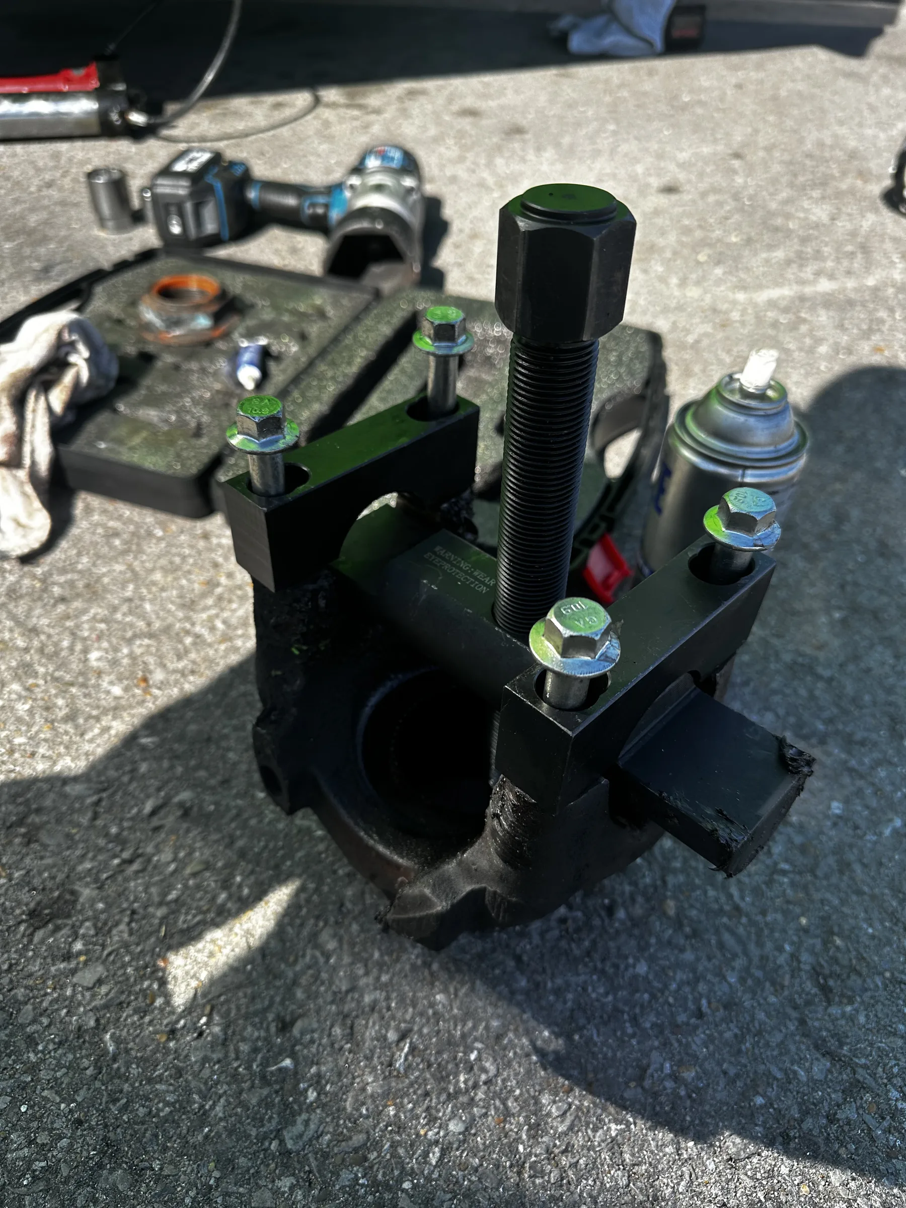 Bearing puller and press tool laid out on the ground