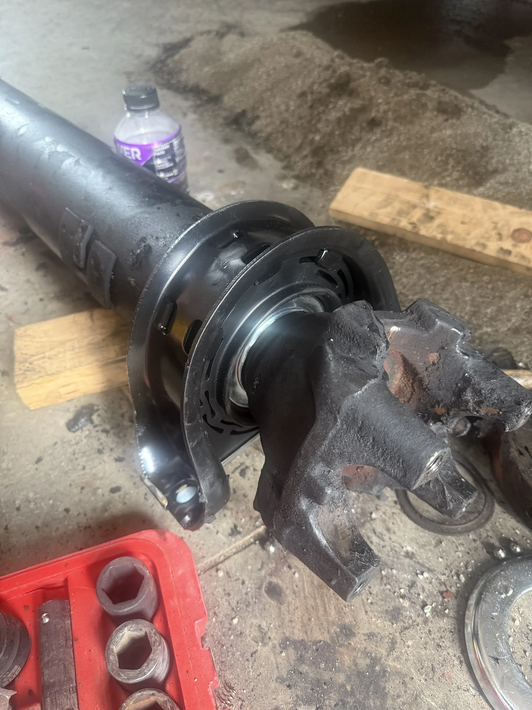 Drive shaft and U-joint laid out on the shop floor