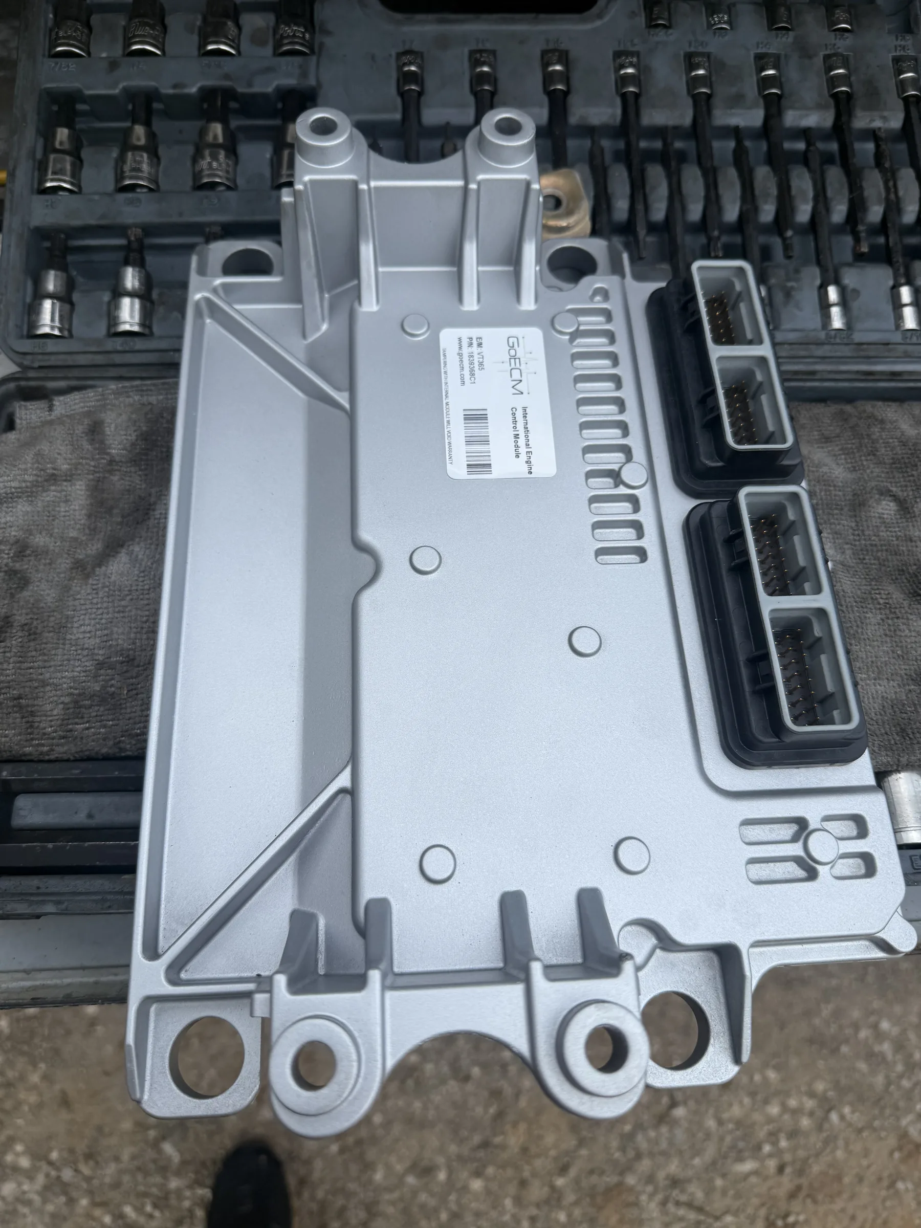 Engine control module on a workbench after removal