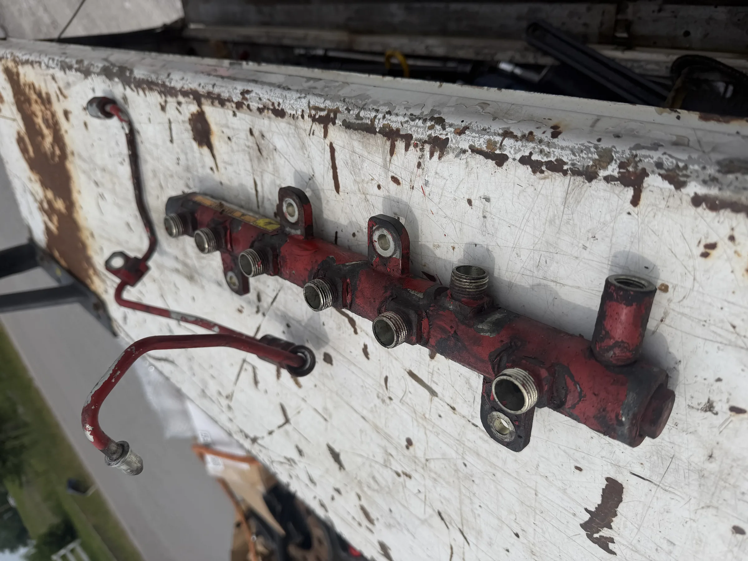 Fuel rail manifold on a workbench