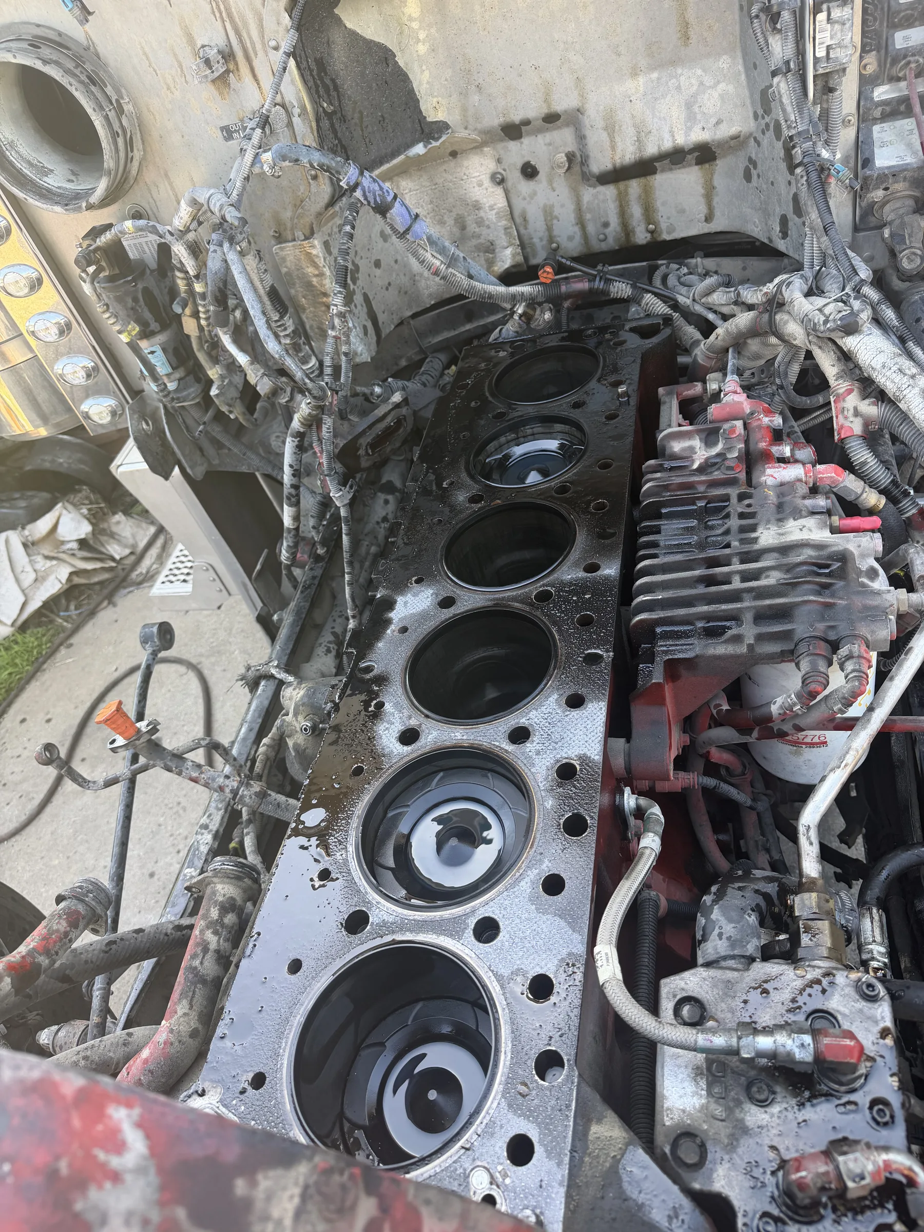 Engine block with flywheel exposed during transmission access