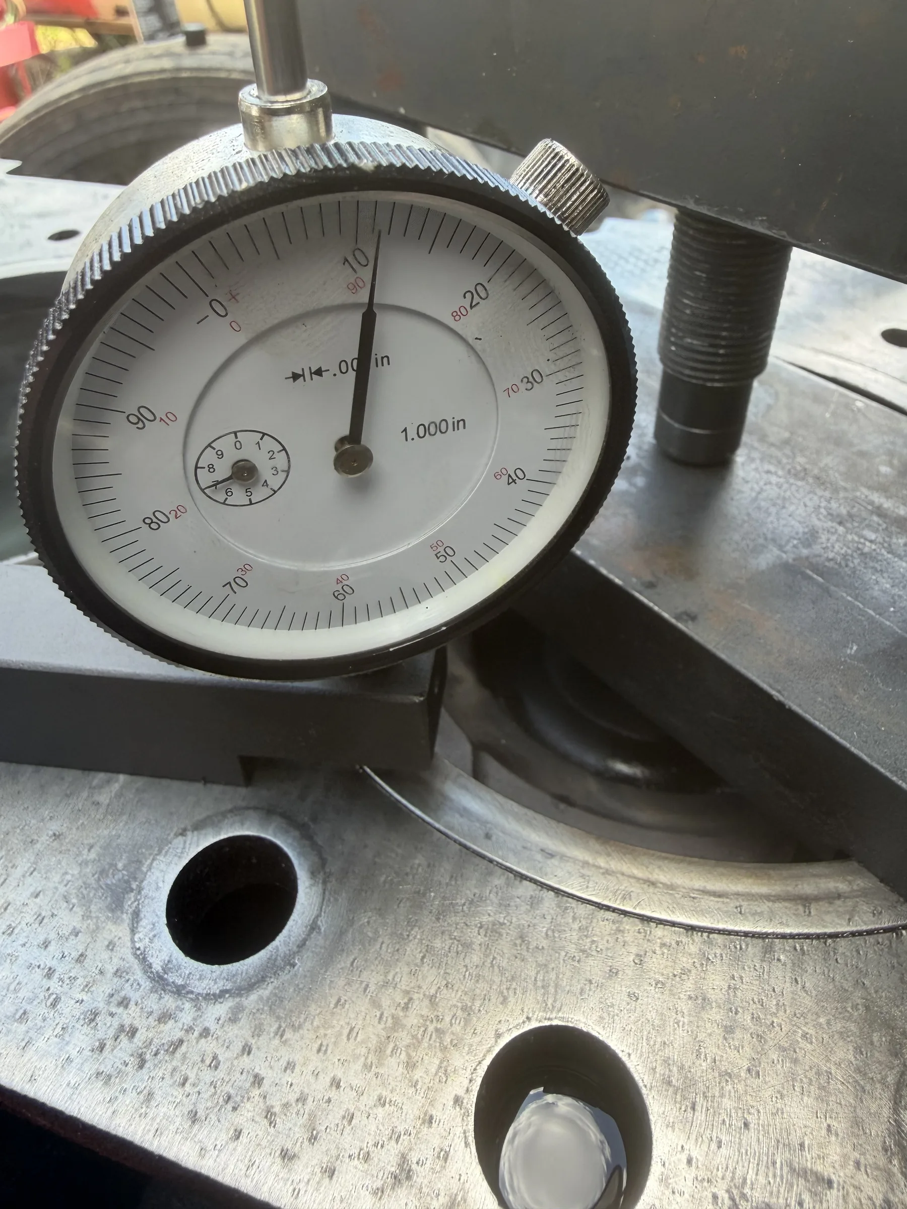 Dial indicator gauging a flange surface