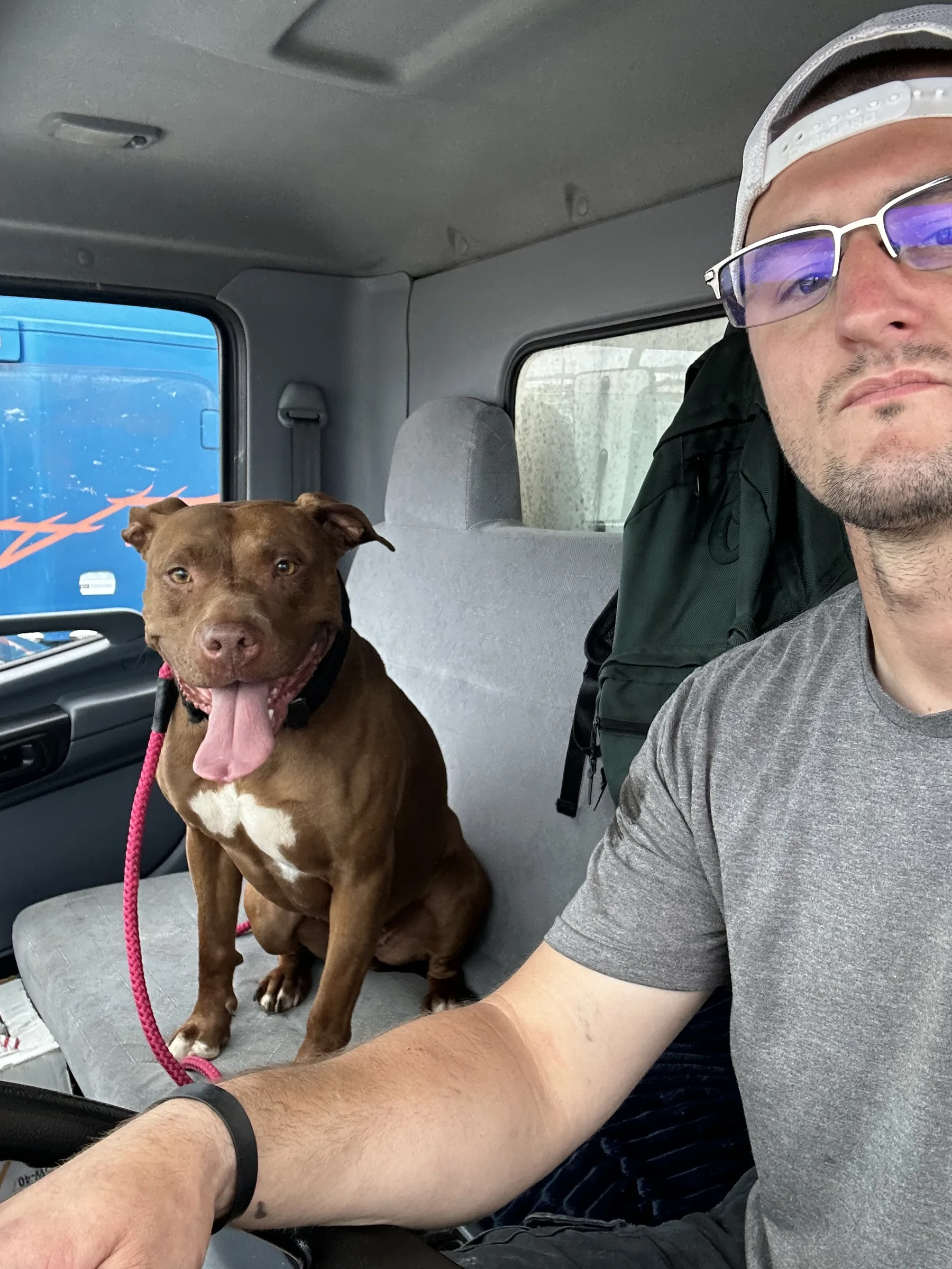 Brennan in the cab of the service truck — owner-operator running every call himself