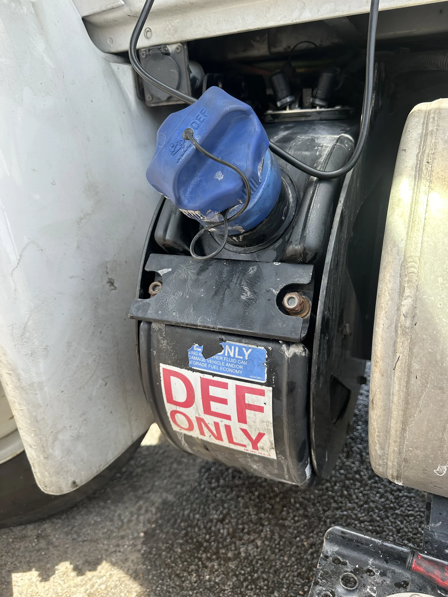 DEF fill door open at the side of a heavy-duty truck