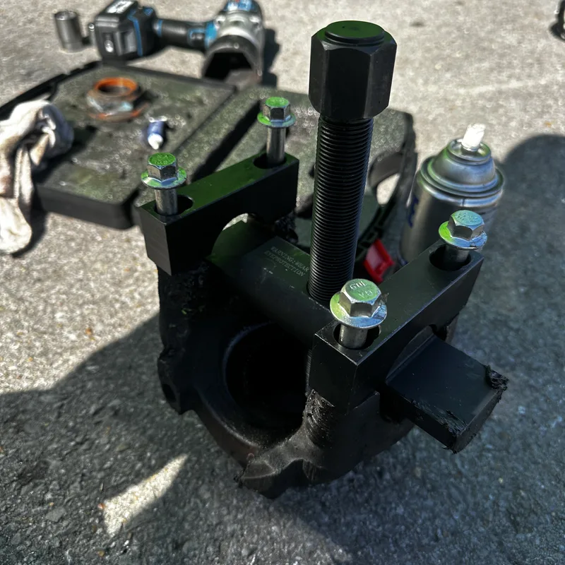 Bearing puller and press tool laid out on the ground