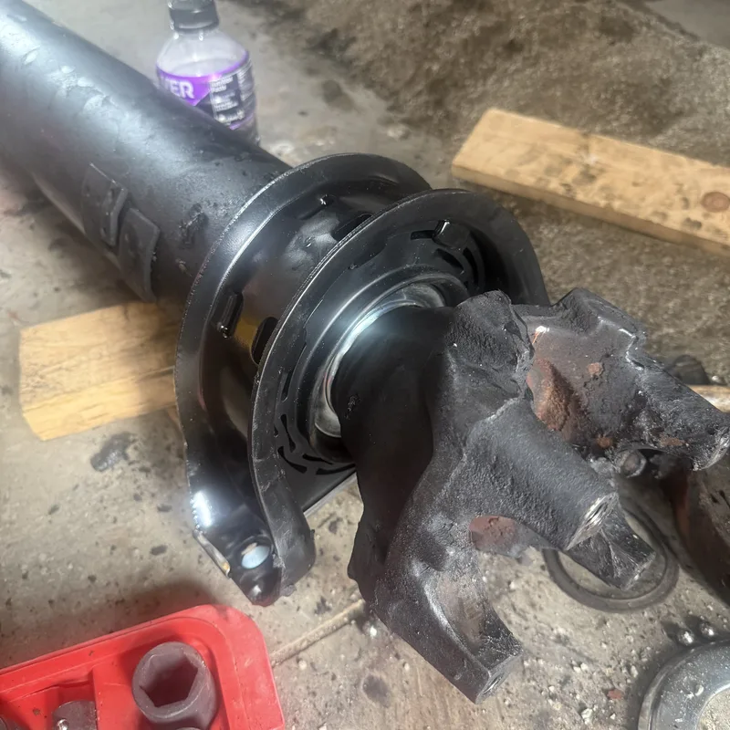 Drive shaft and U-joint laid out on the shop floor