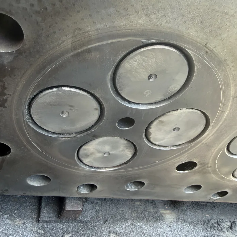 Engine block opened with cylinders and pistons exposed