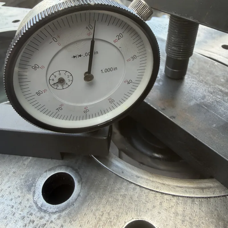 Dial indicator gauging a flange surface